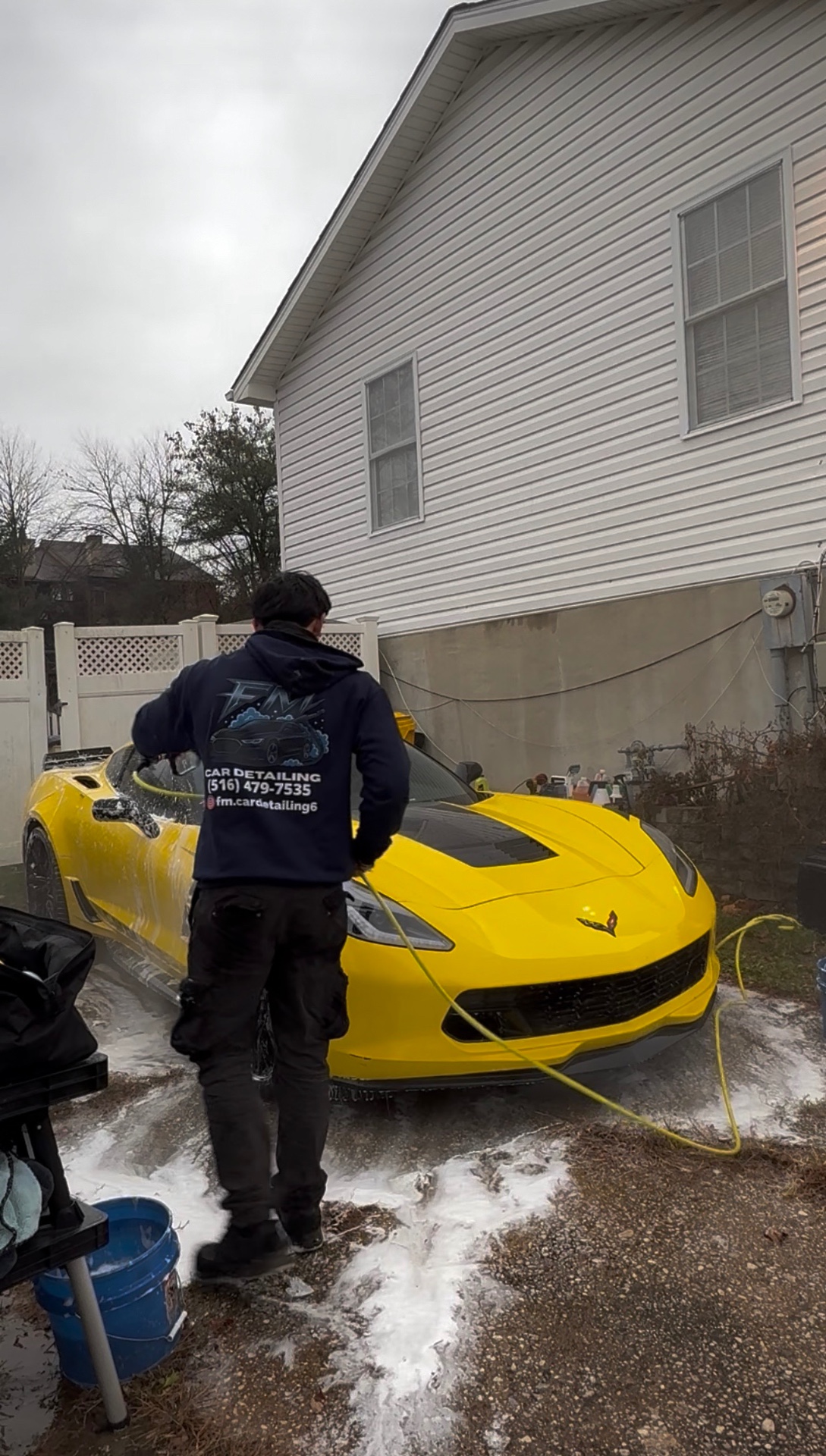 Yellow sports car being washed at a customer's location