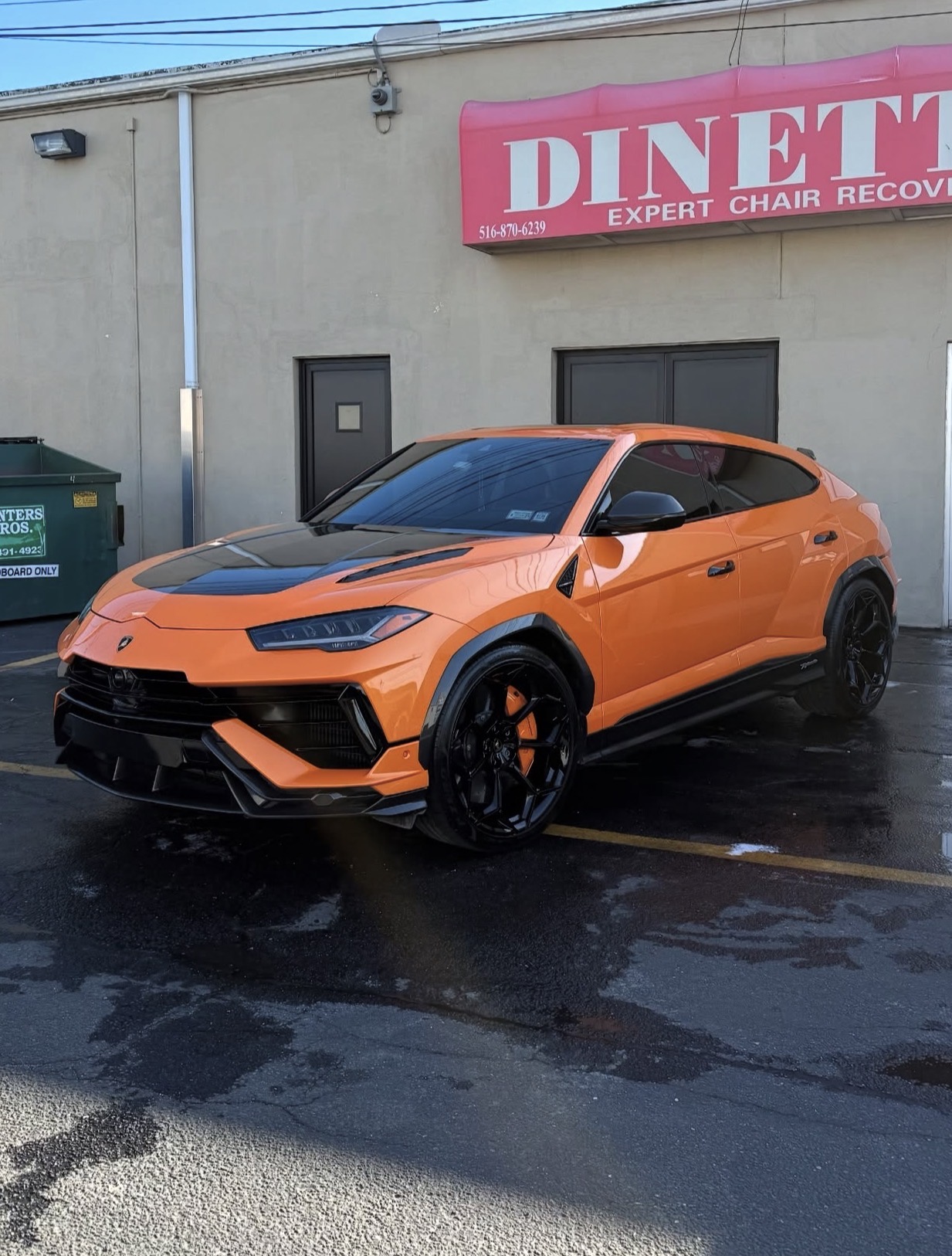 Orange performance SUV with a freshly detailed exterior